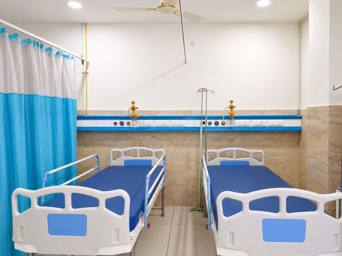 Inpatient recovery room with piped oxygen and 24-hour nursing at RAMS Andrology & Urology Centre, Hanamkonda